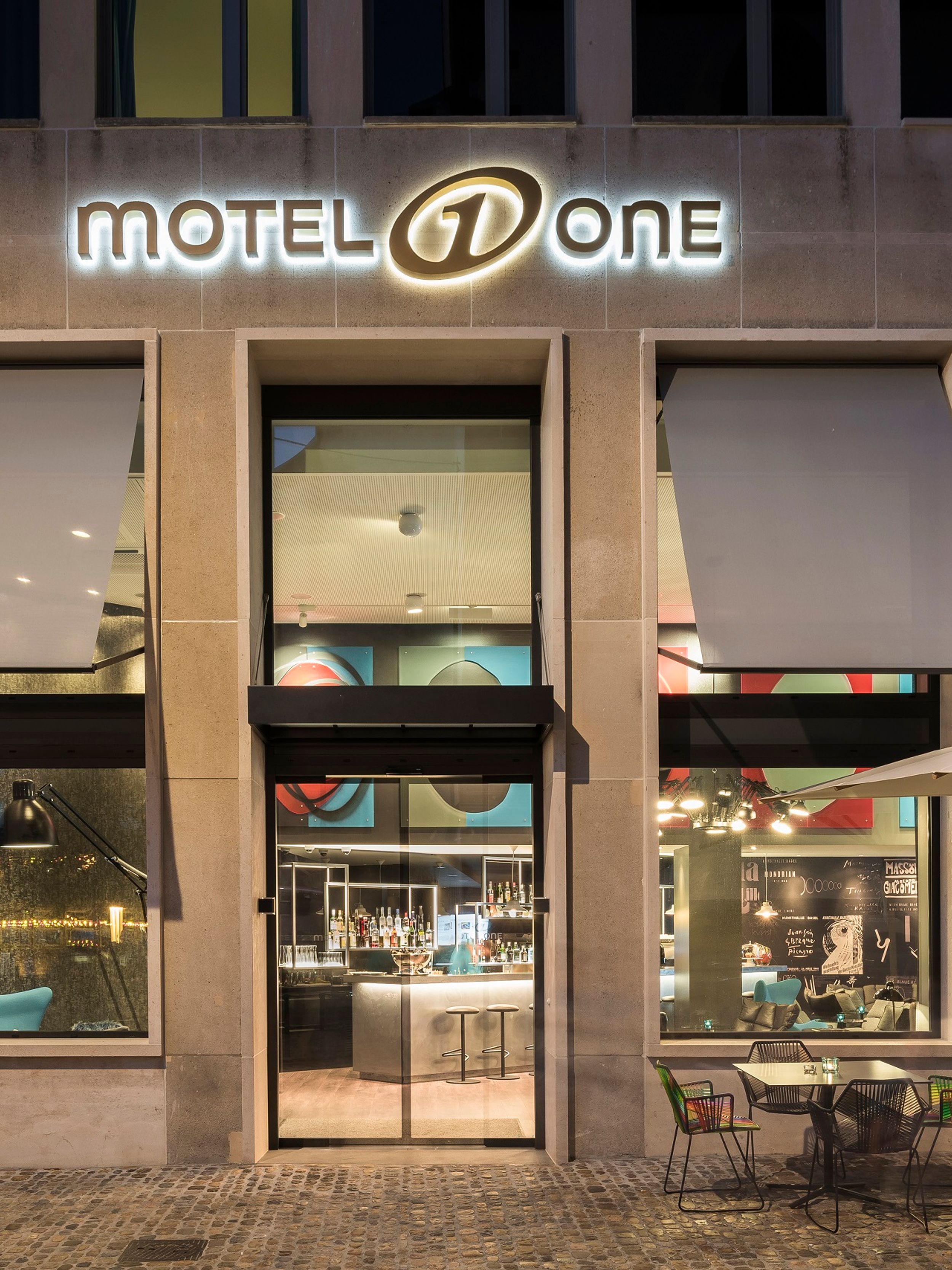 hotel Basel Motel One view from outside of the hotel entrance area with seating