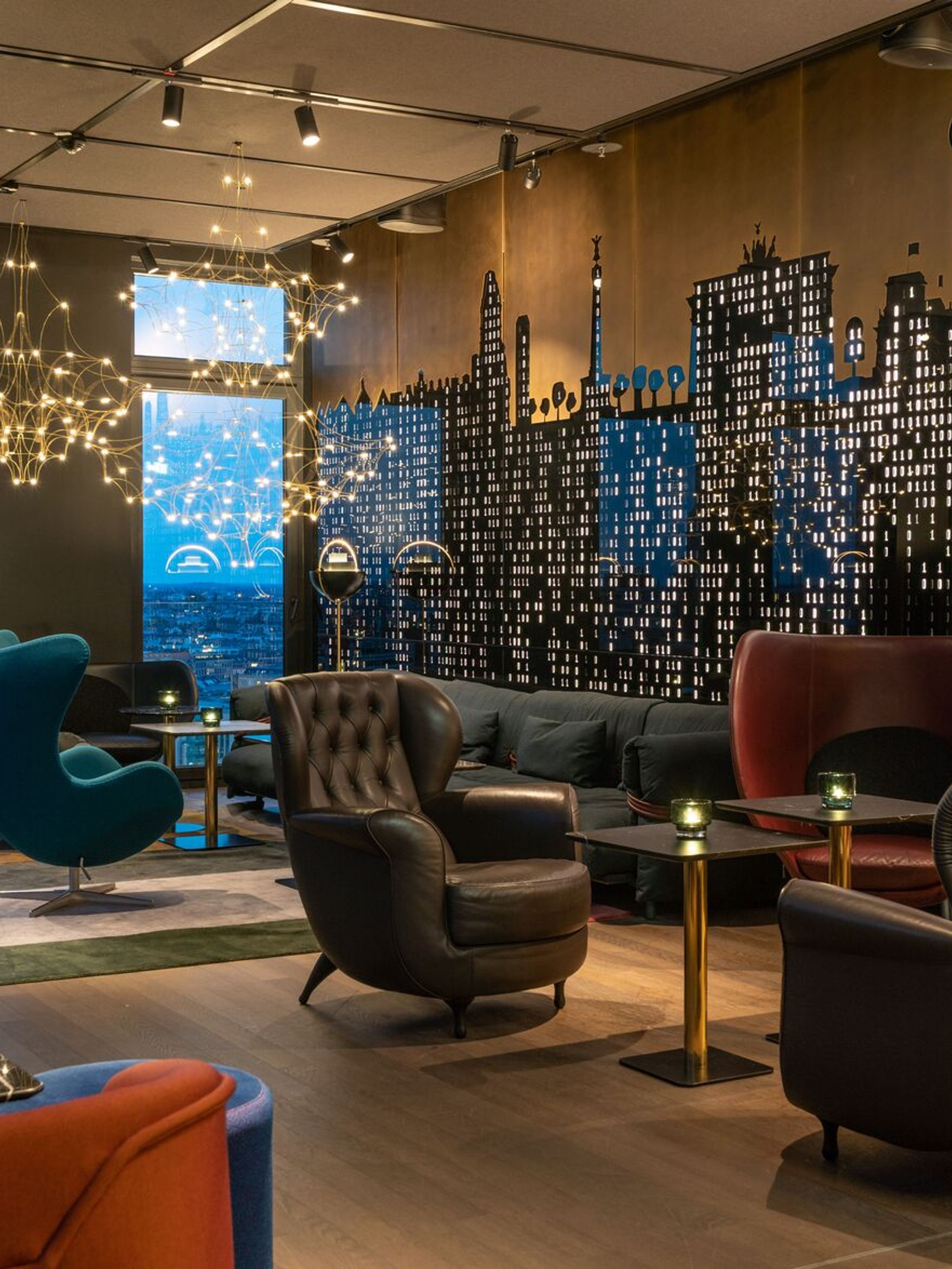 hotel Berlin Alexanderplatz Motel One light-filled lounge with floor-to-ceiling windows and views over the city rooftops