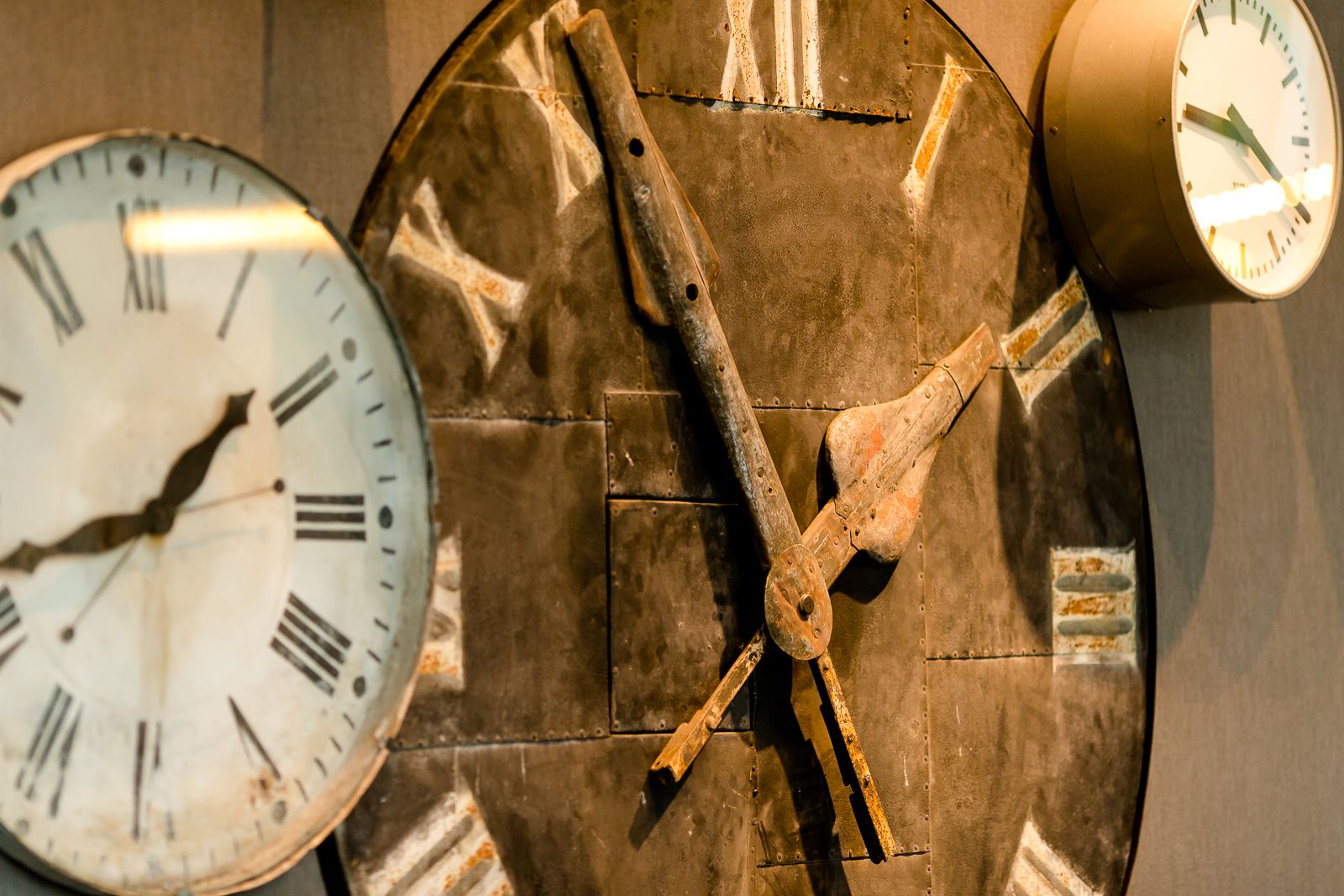 hotel Berlin Hauptbahnhof Motel One close-up of three large different clocks on the wall