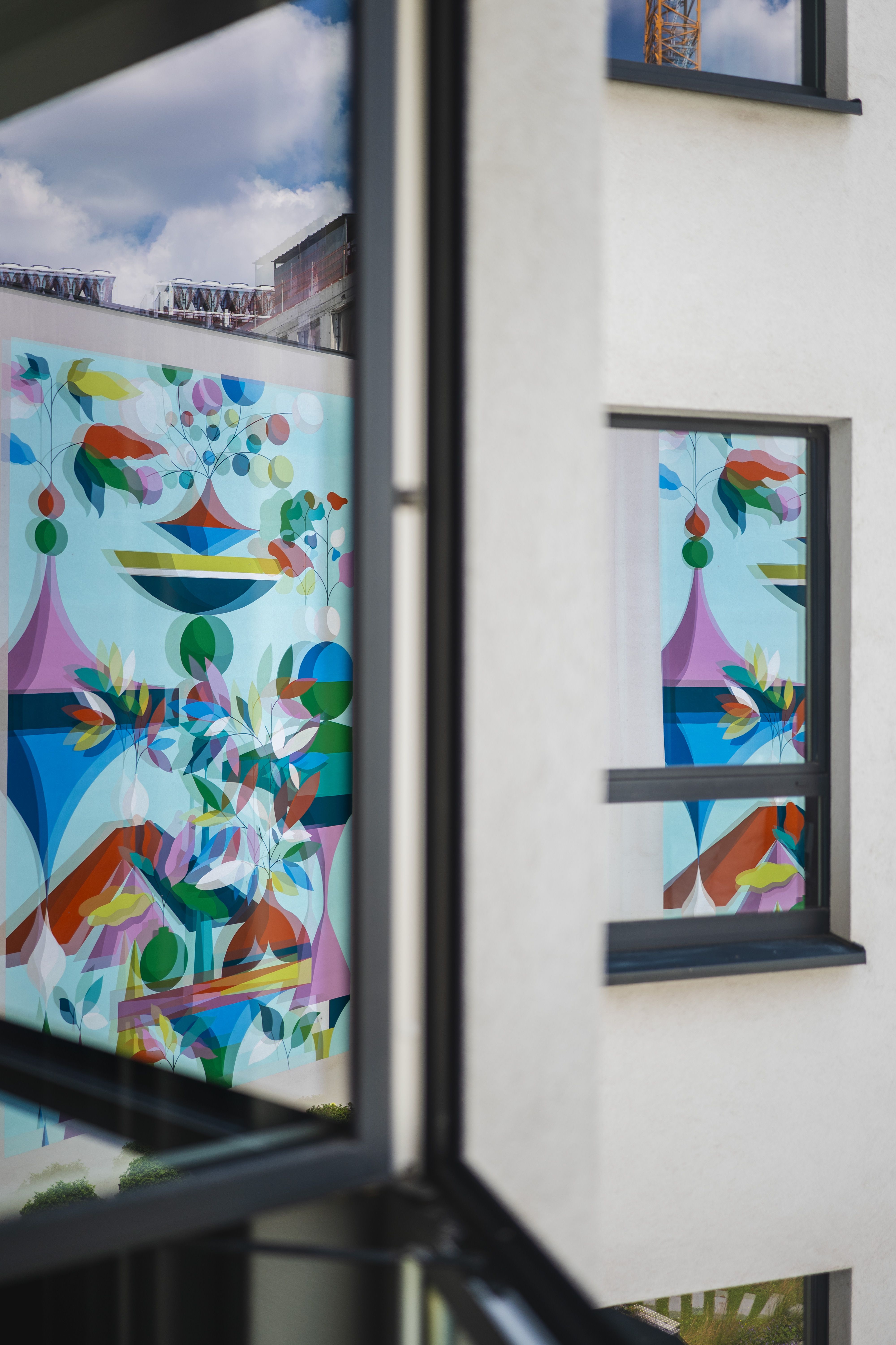 Design hotel Brussels Motel One mural reflected in window panes