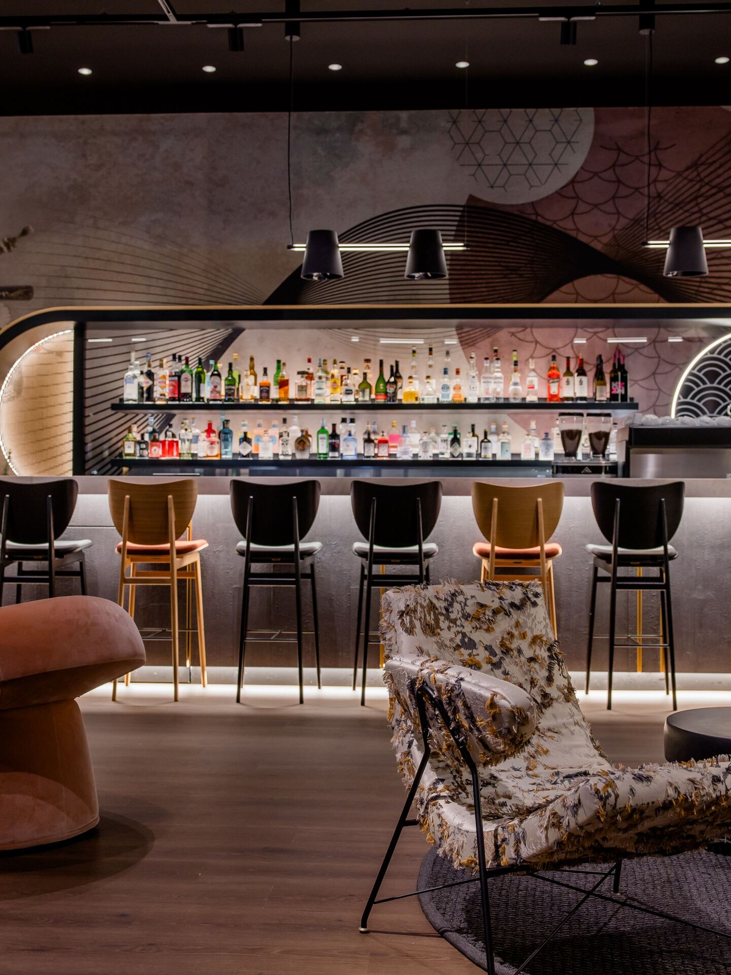 Hotel Dusseldorf Hauptbahnhof Motel One view across several seating areas towards the bar