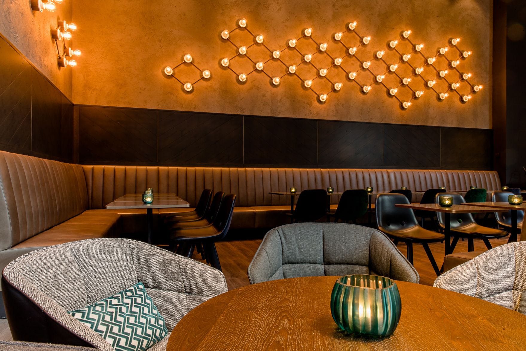 hotel Glasgow Motel One lounge seating with large corner bench and several chairs