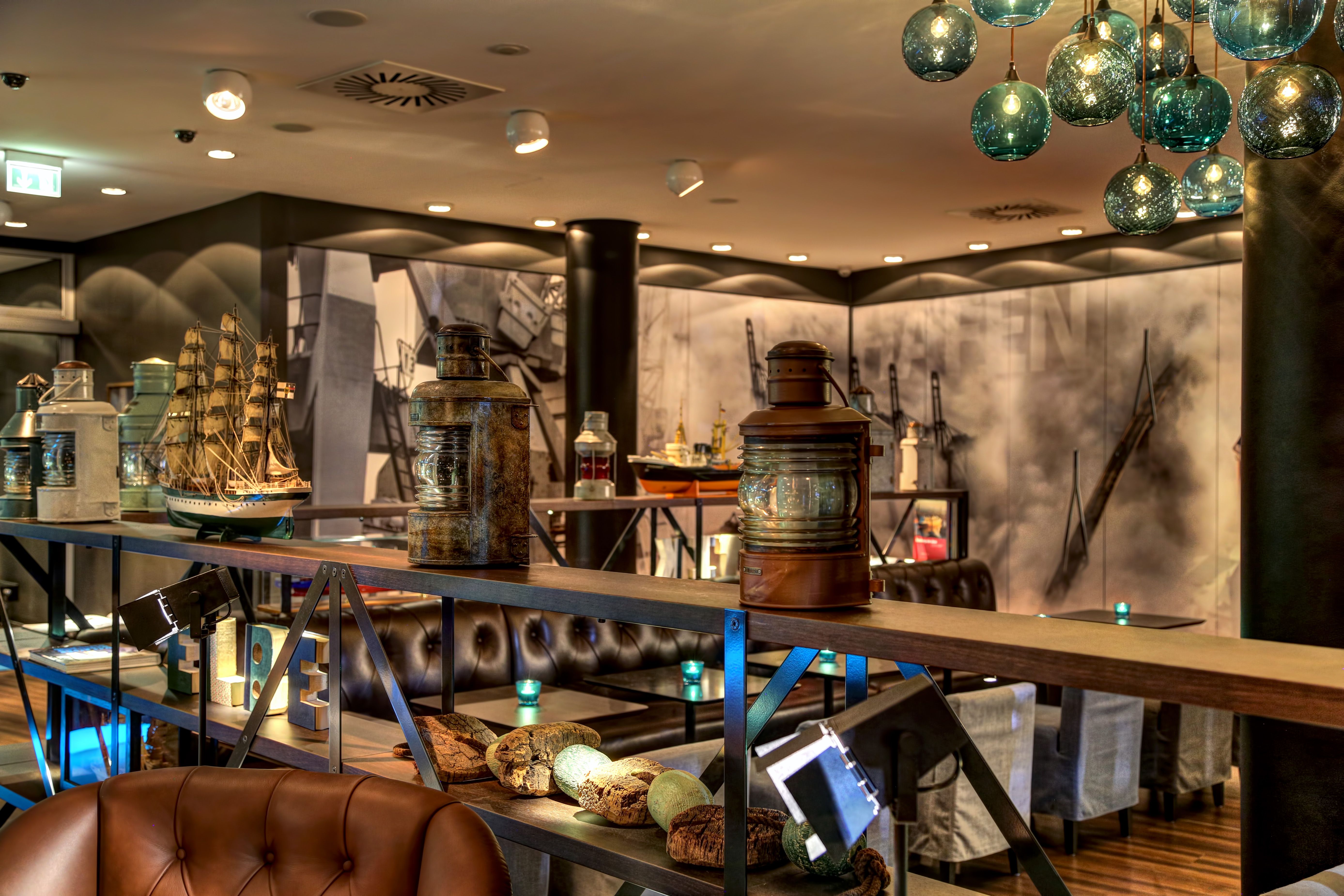 hotel Hamburg am Michel Motel One lounge with open shelf and decoration