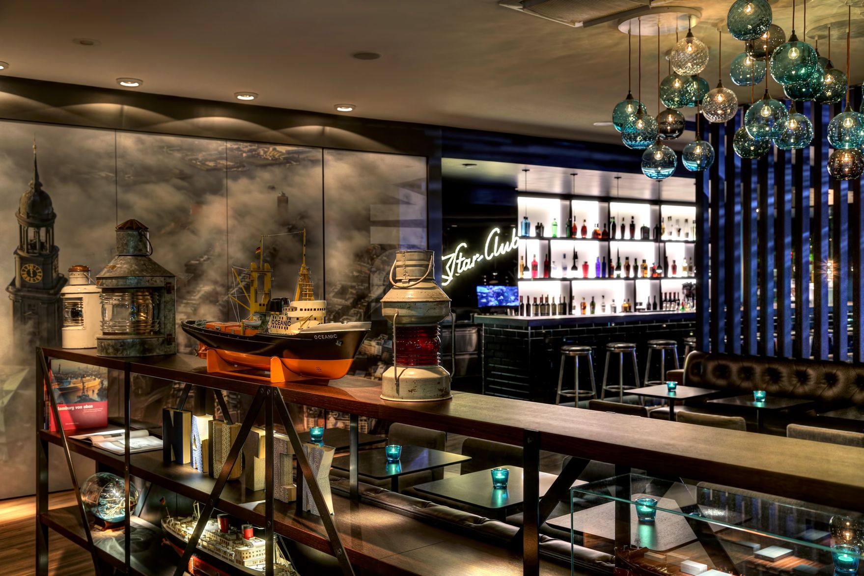 hotel Hamburg am Michel Motel One lounge and bar with open shelving in the foreground