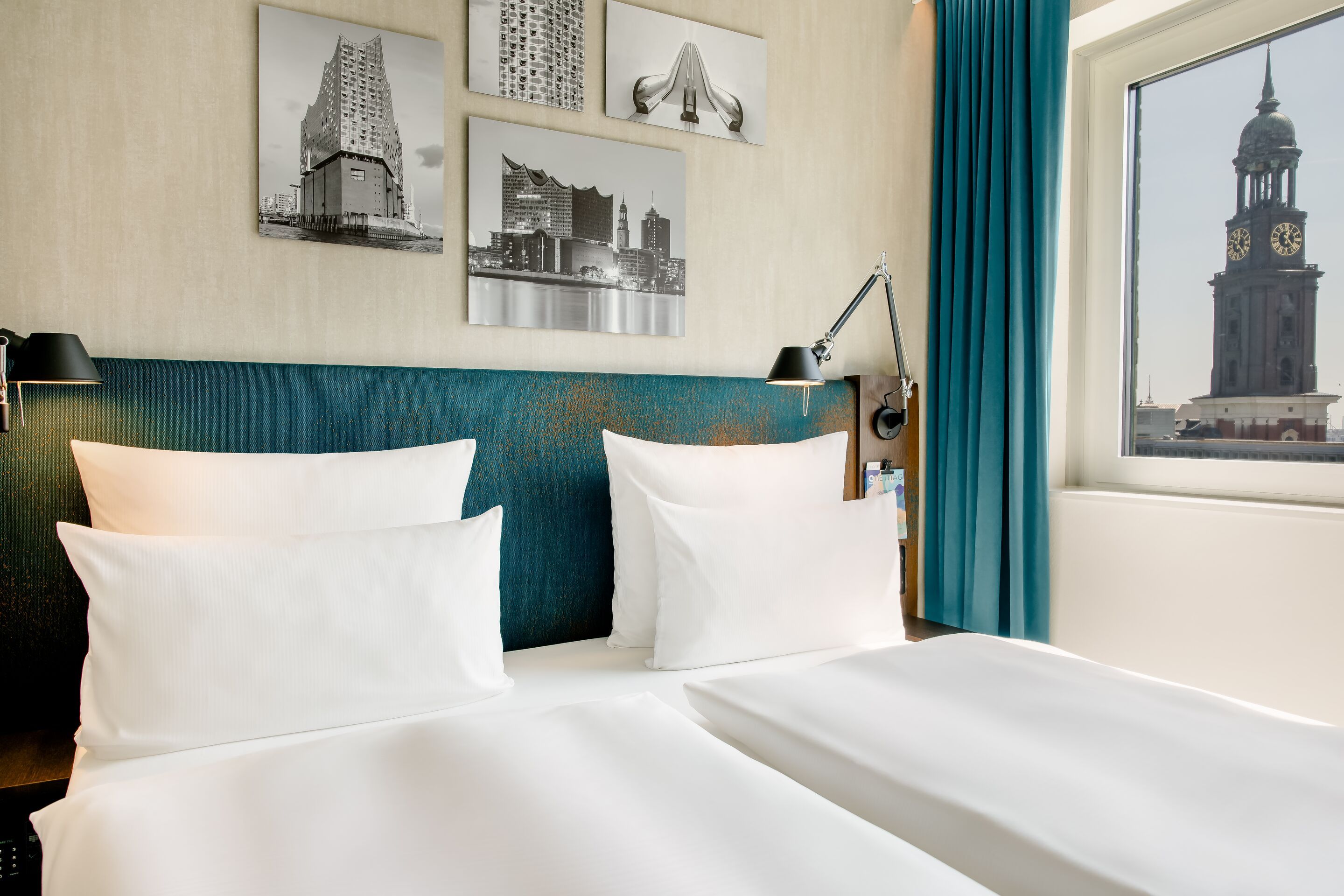 hotel Hamburg am Michel Motel One view of double bed and pictures of Hamburg above the bed