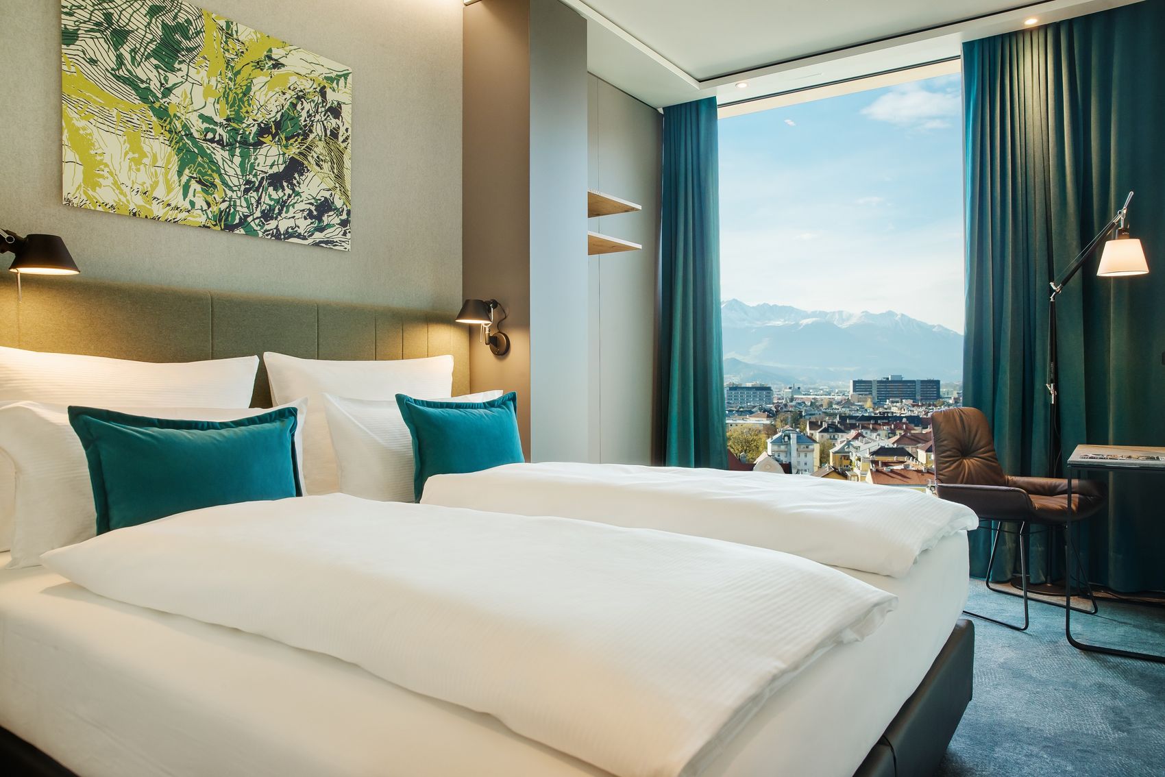 hotel Innsbruck Motel One light-flooded room with a view over the city and the mountains