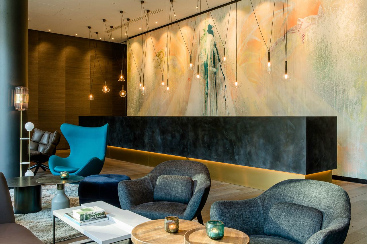 hotel Cologne Neumarkt Motel One reception with armchair and egg chair