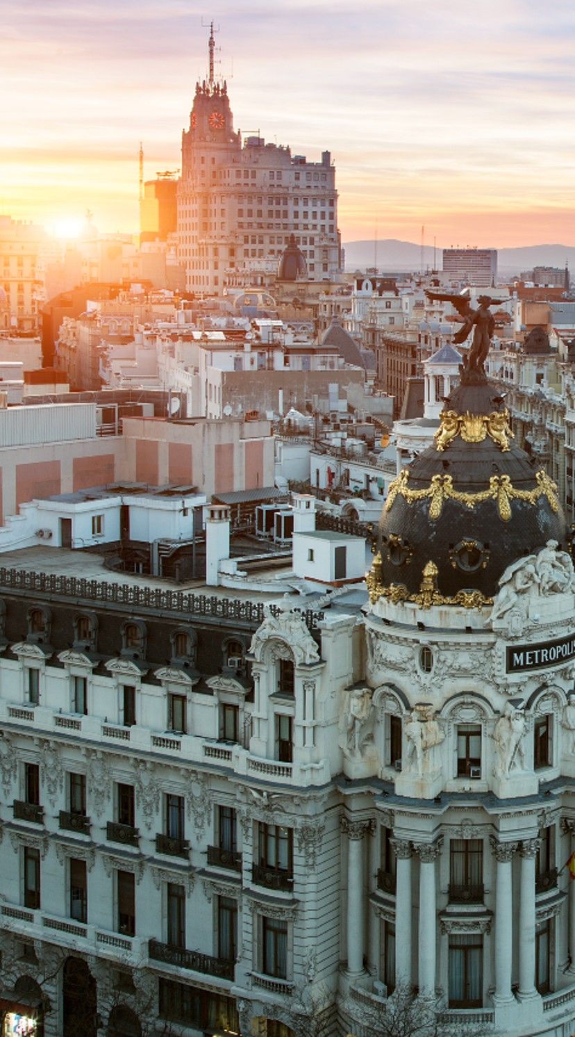 designhotel Madrid Motel One view of the city's rooftops from above at sunset