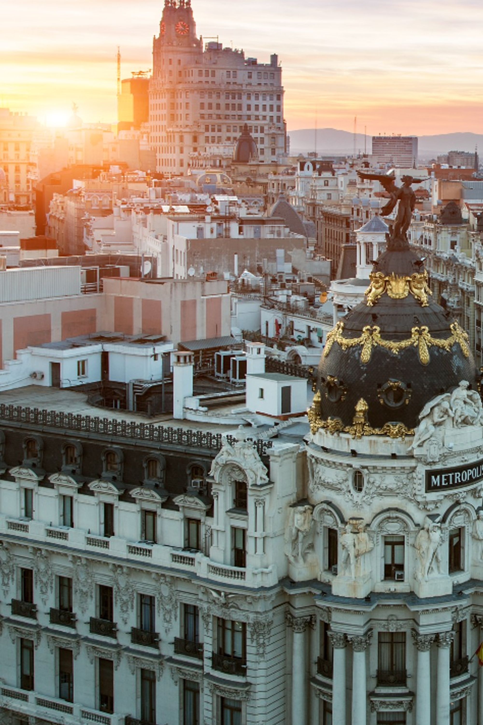 designhotel Madrid Motel One view of the city's rooftops from above at sunset