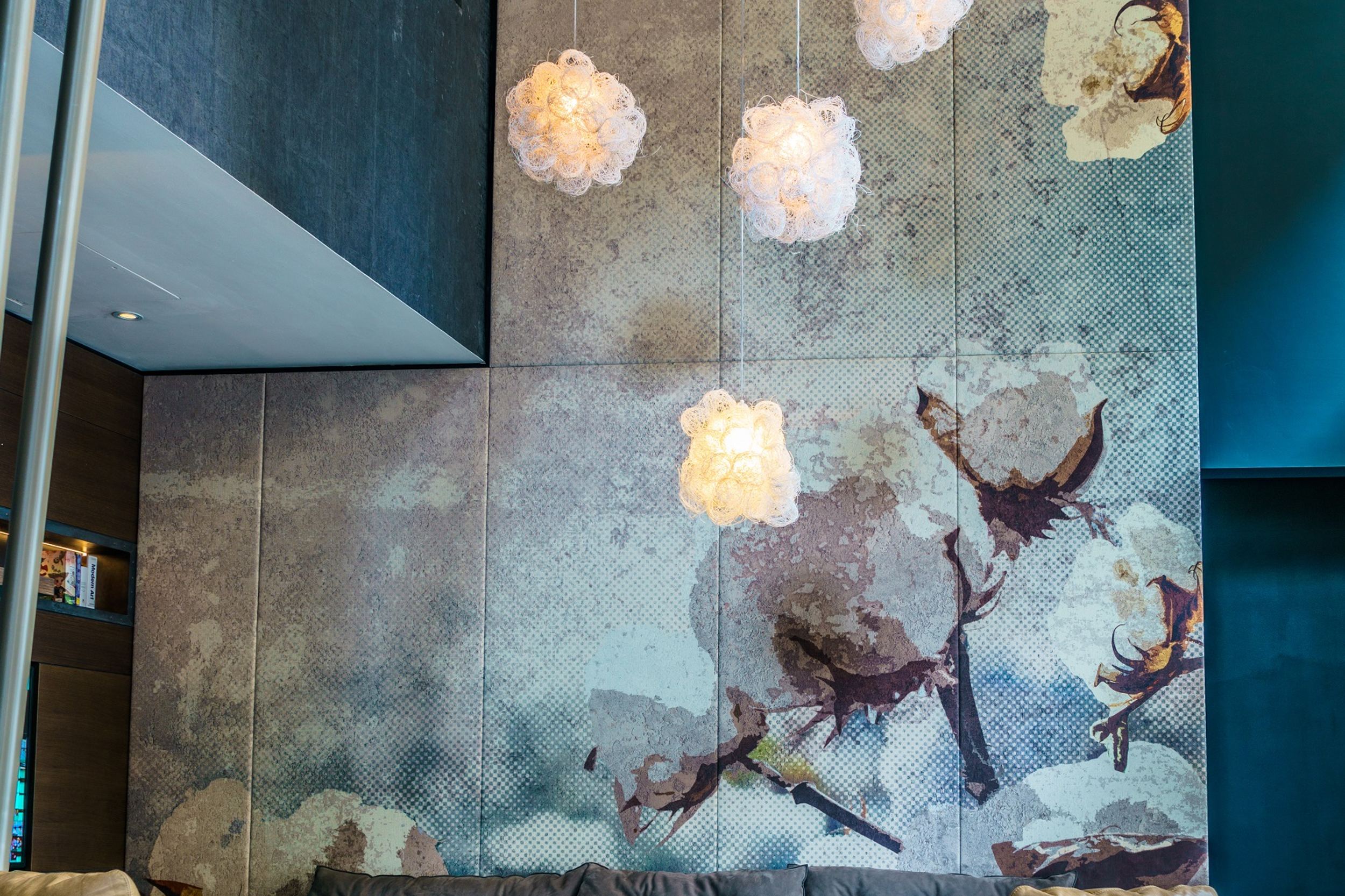 hotel Manchester Royal Exchange Motel One bright seating area with comfortable couch and two armchairs