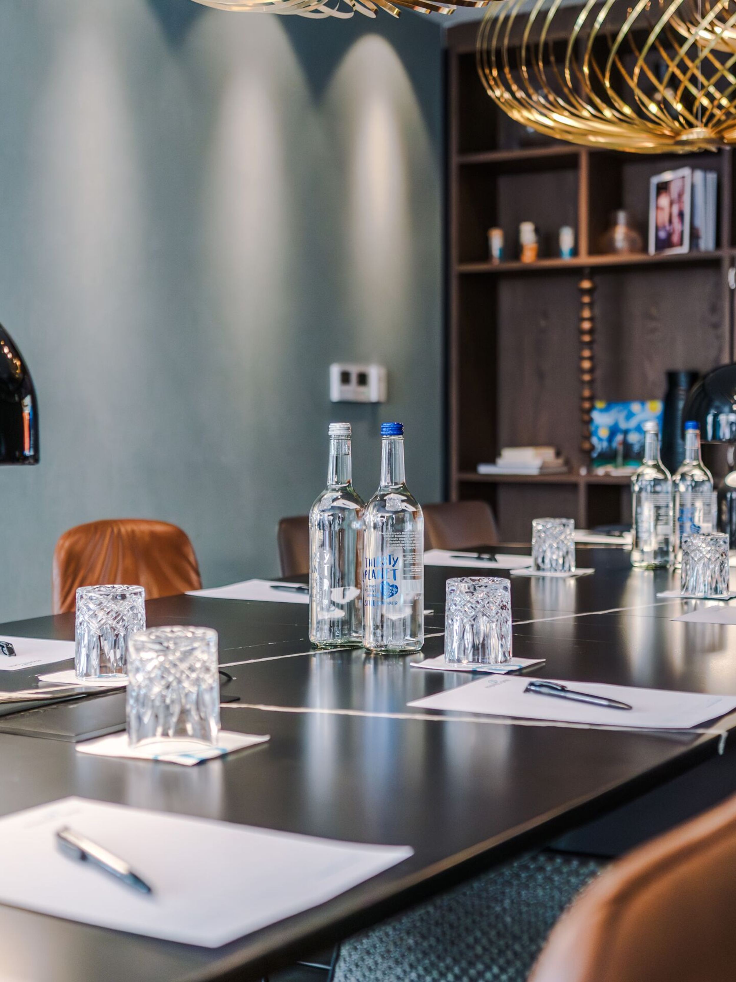 hotel Manchester Royal Exchange Motel One meeting room prepared table with pads, pens and drinks