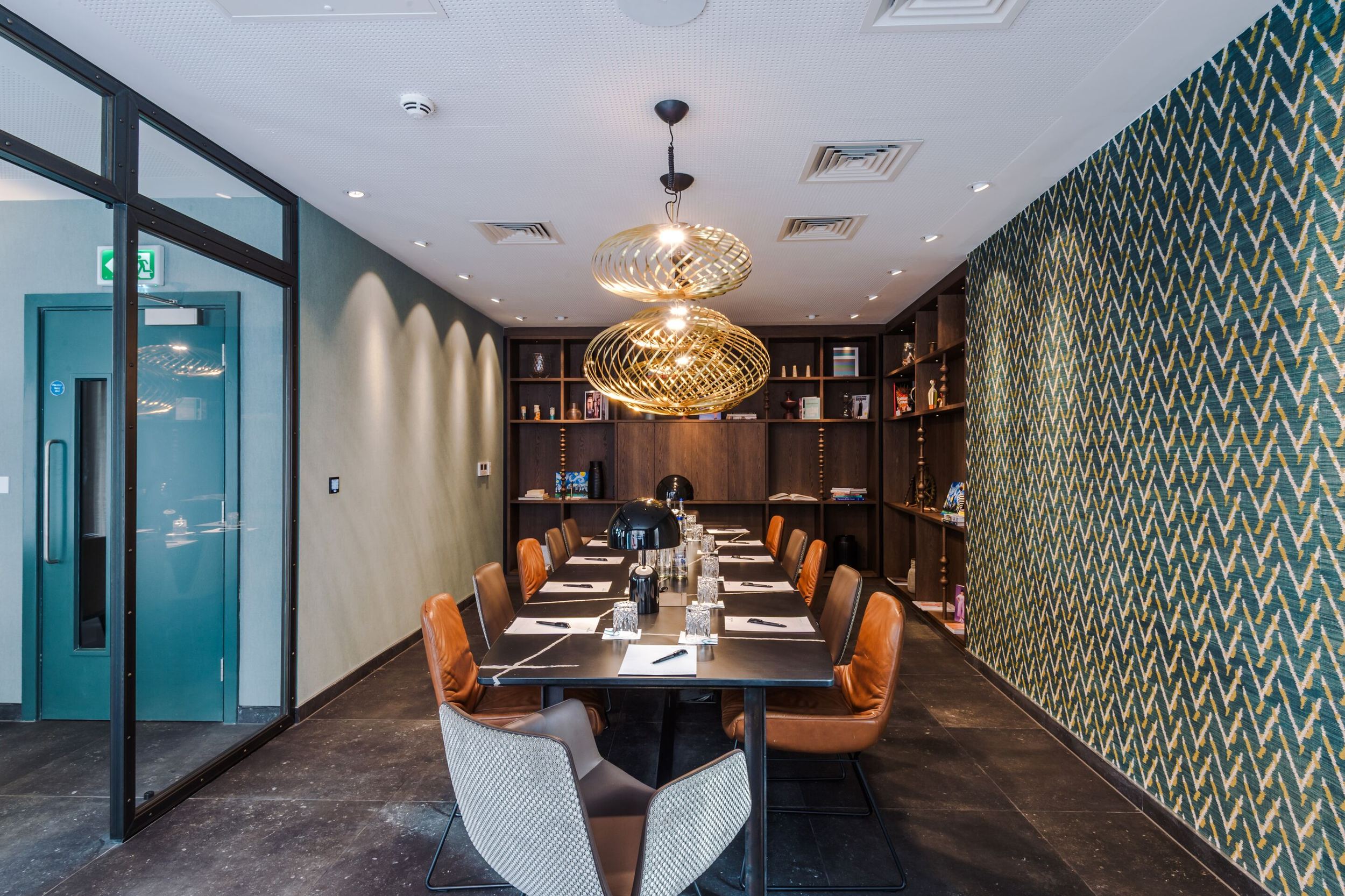 hotel Manchester Royal Exchange Motel One view into a bright meeting room with a large table in the middle of the room