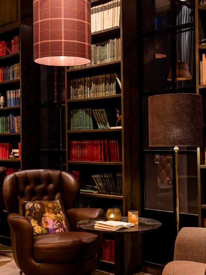 hotel Manchester St. Peter's Square armchairs in front of a high bookshelf