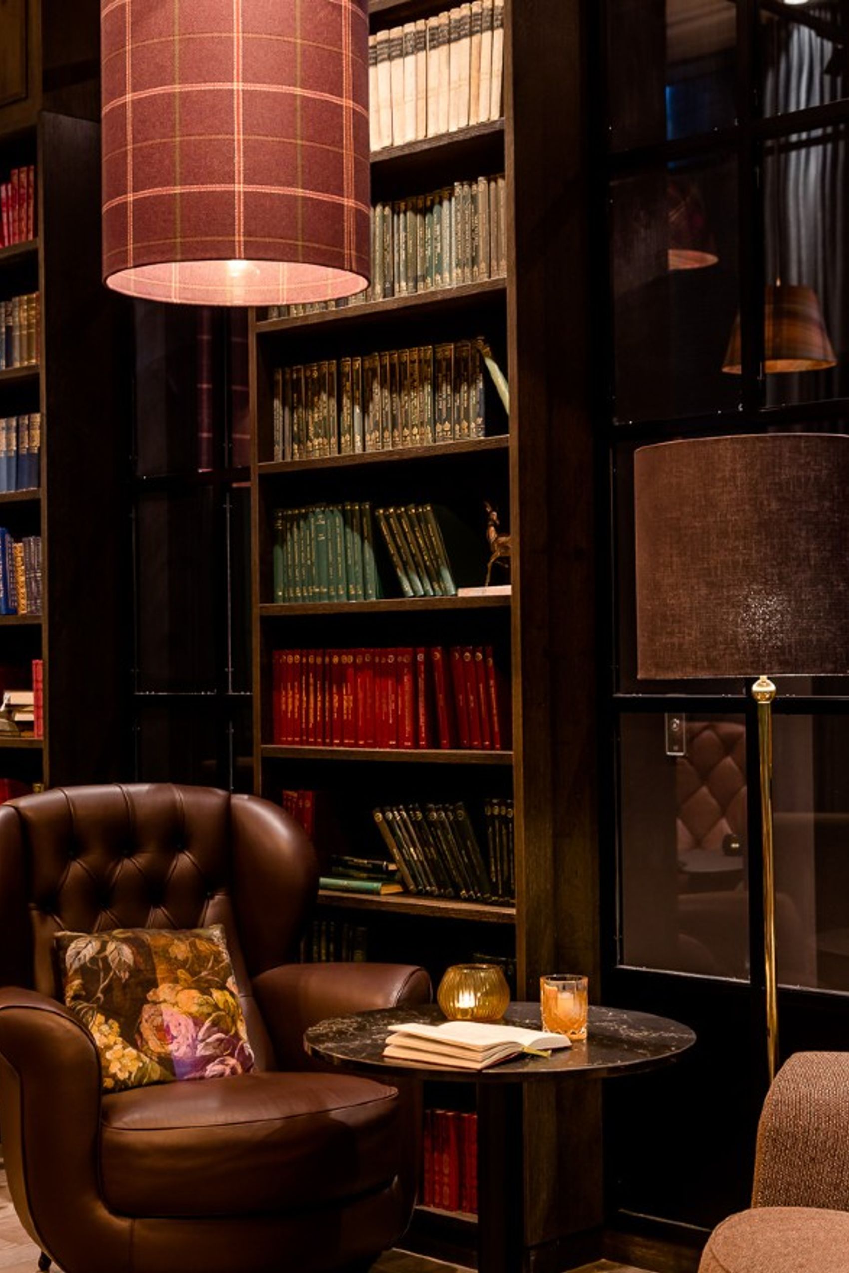 hotel Manchester St. Peter's Square armchairs in front of a high bookshelf