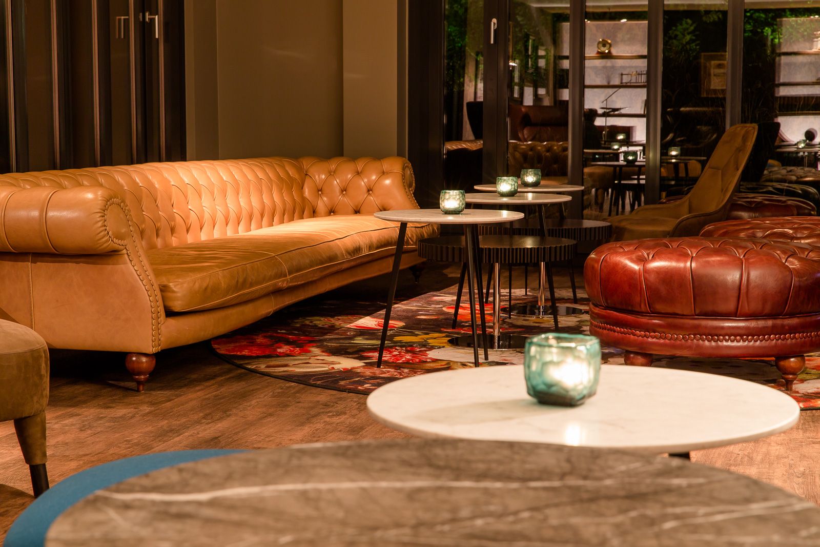 designhotel Munich Deutsches Museum Motel One lounge in the evening with large couch and armchair