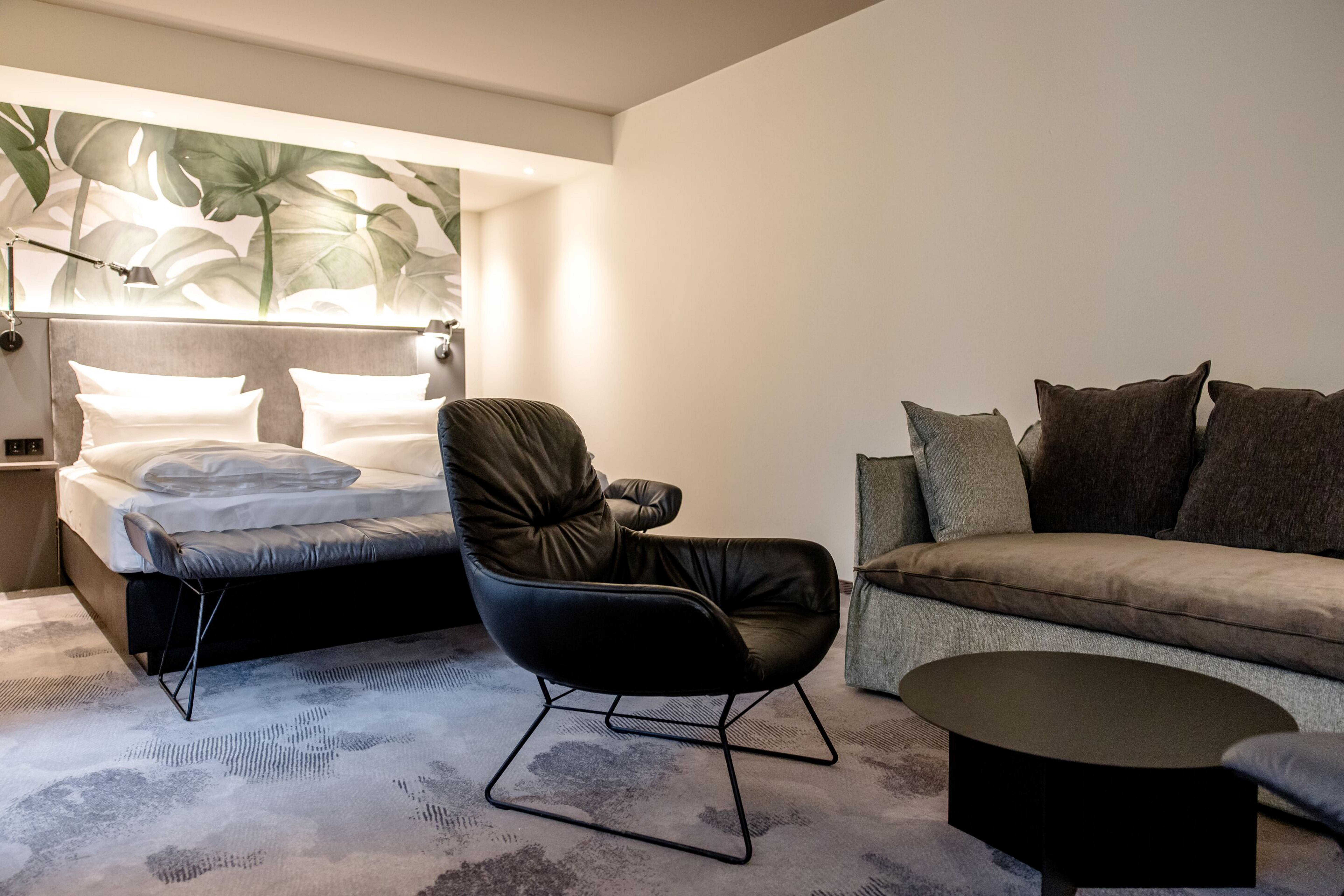 hotel Munich Hauptbahnhof Motel One spacious hotel room with double bed, sofa, couch hotel Munich Hauptbahnhof Motel One spacious hotel room with double bed, sofa, couch