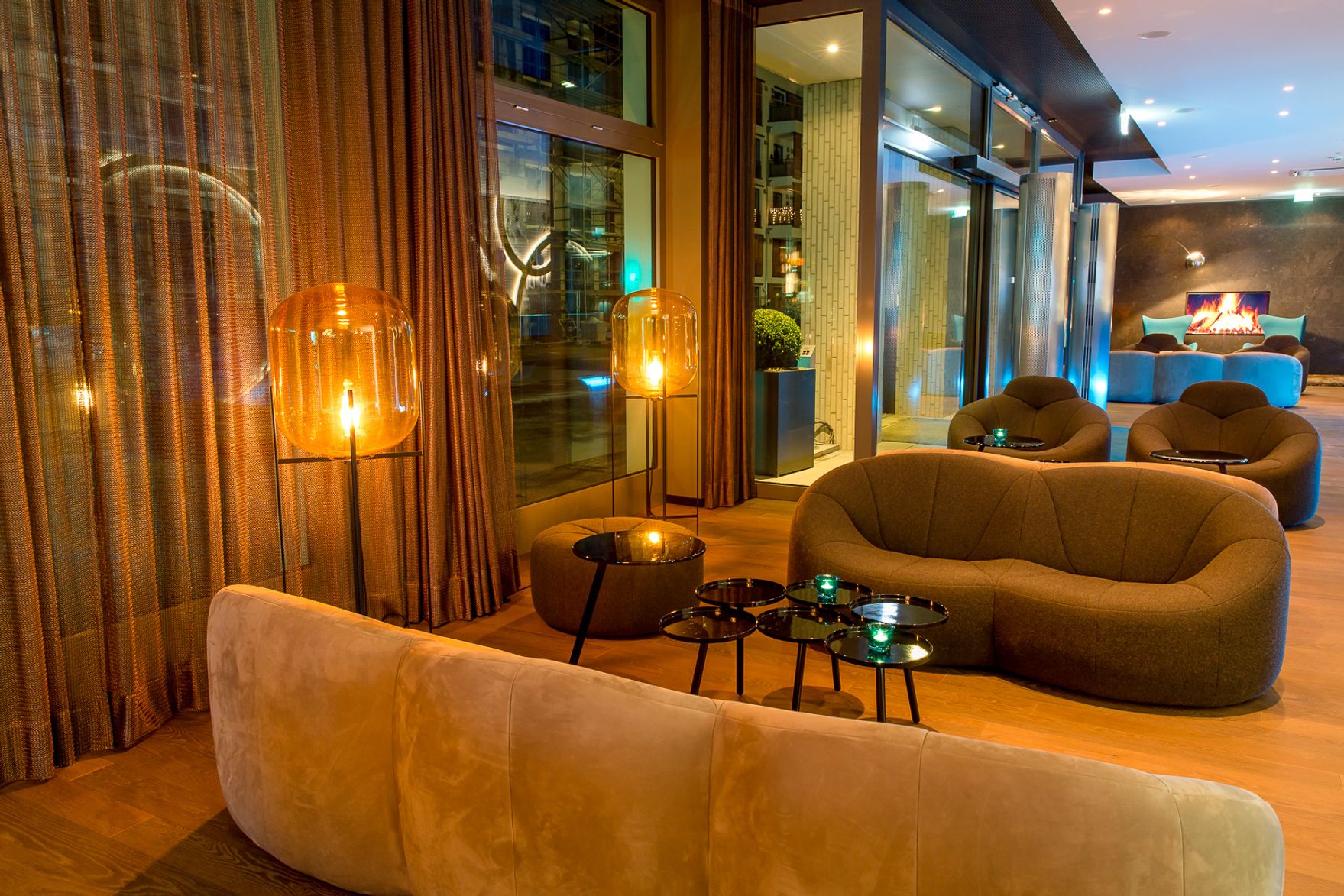 designhotel Munich Olympia Gate Motel One lounge in the evening with armchairs