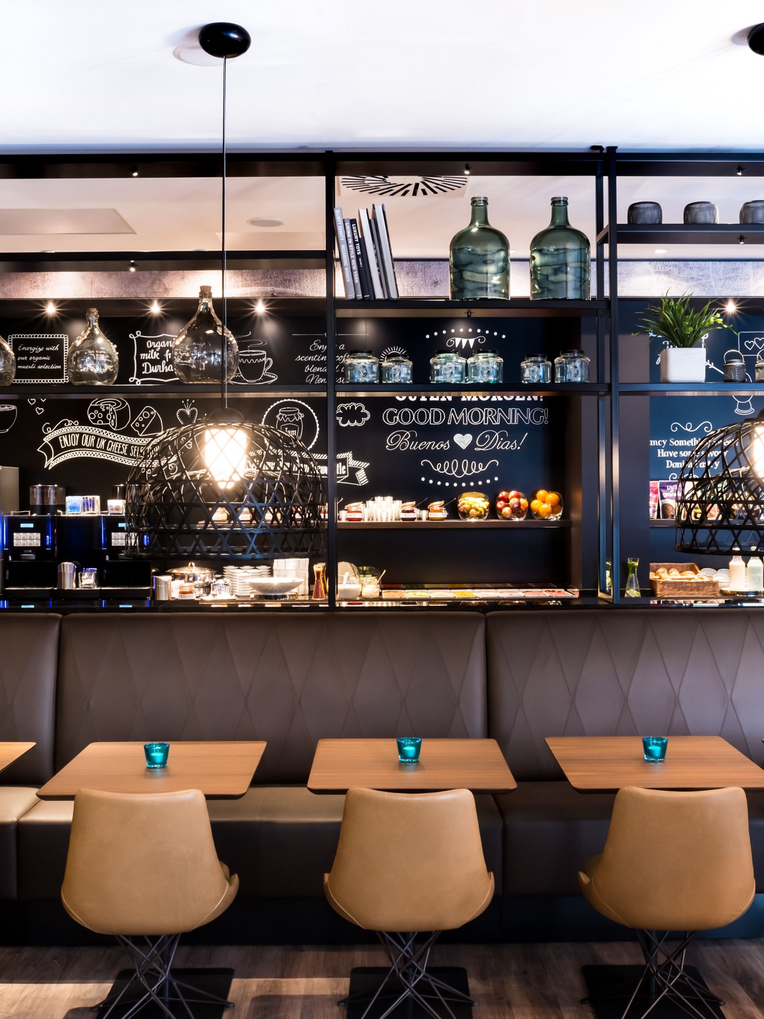 hotel Newcastle Motel One breakfast room with seating and buffet