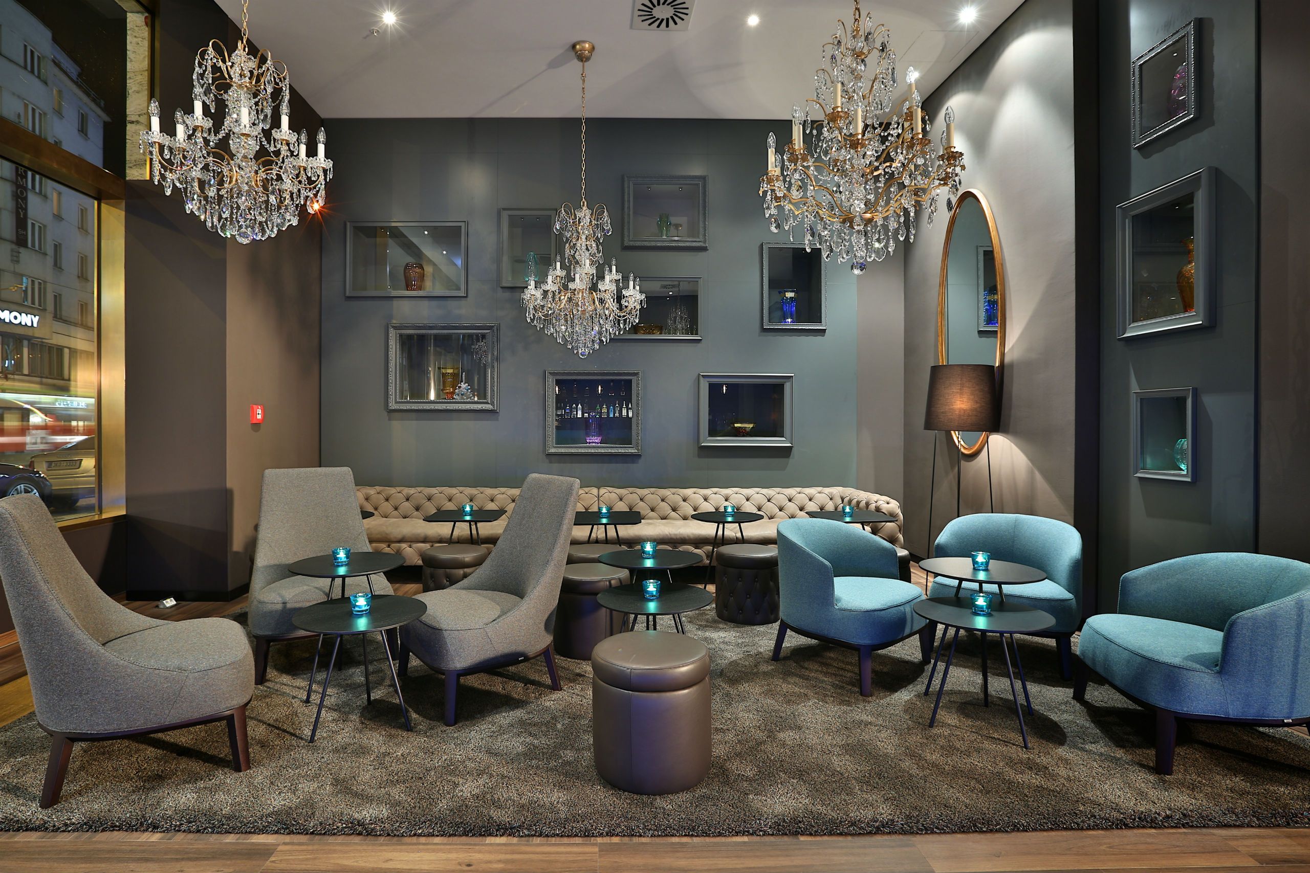 hotel Prague Florentinum Motel One lounge with sofa and armchairs in the evening