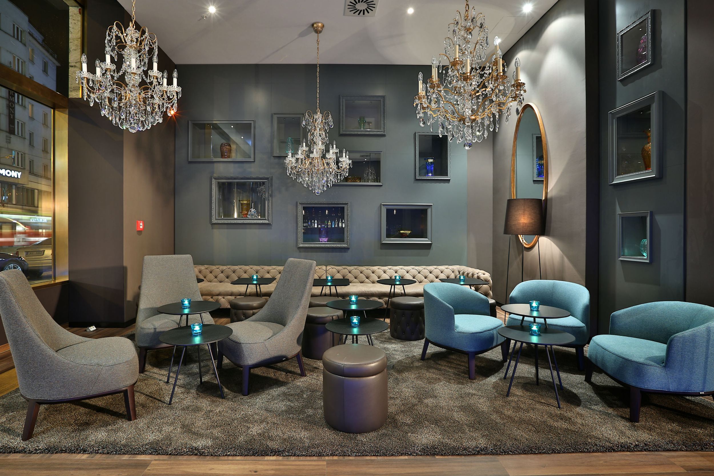 hotel Prague Florentinum Motel One lounge with sofa and armchairs in the evening