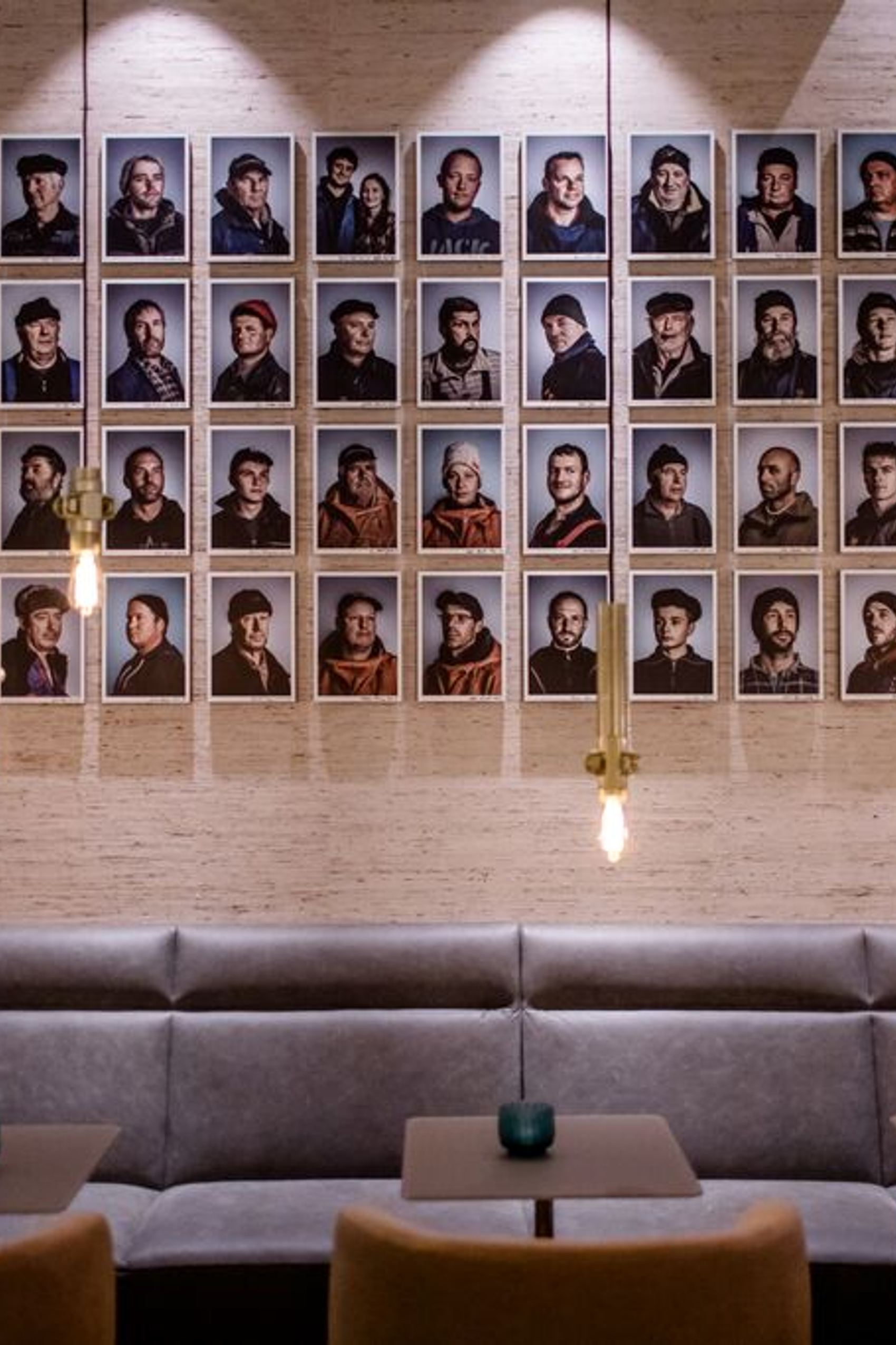 designhotel Rostock Motel One picture gallery on the wall above a long sofa