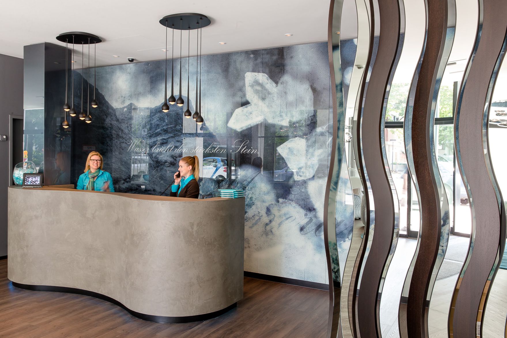 hotel Stuttgart Bad Cannstatt Motel One reception desk with two employees