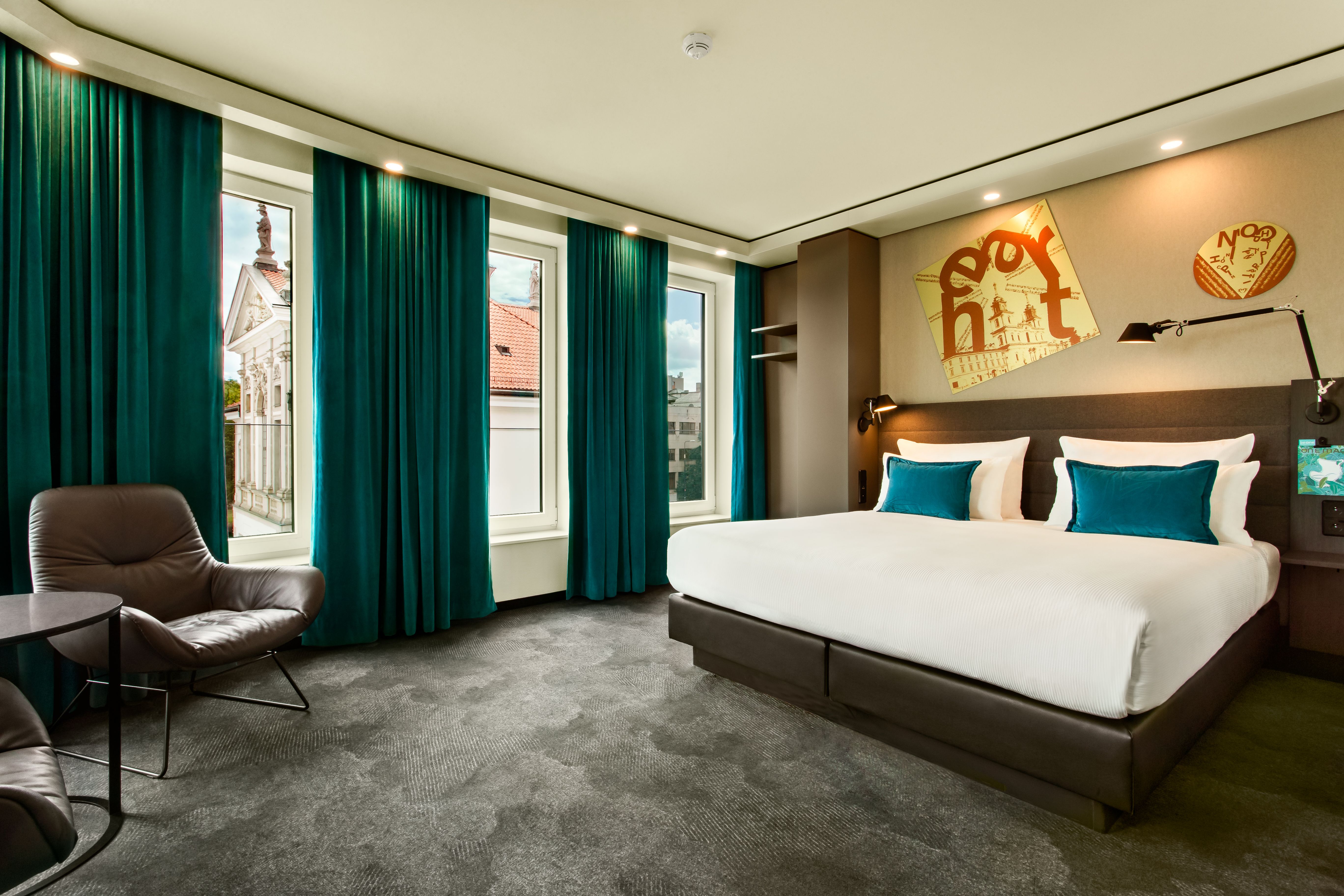 designhotel Warsaw Chopin Motel One large hotel room with double bed and floor-to-ceiling windows