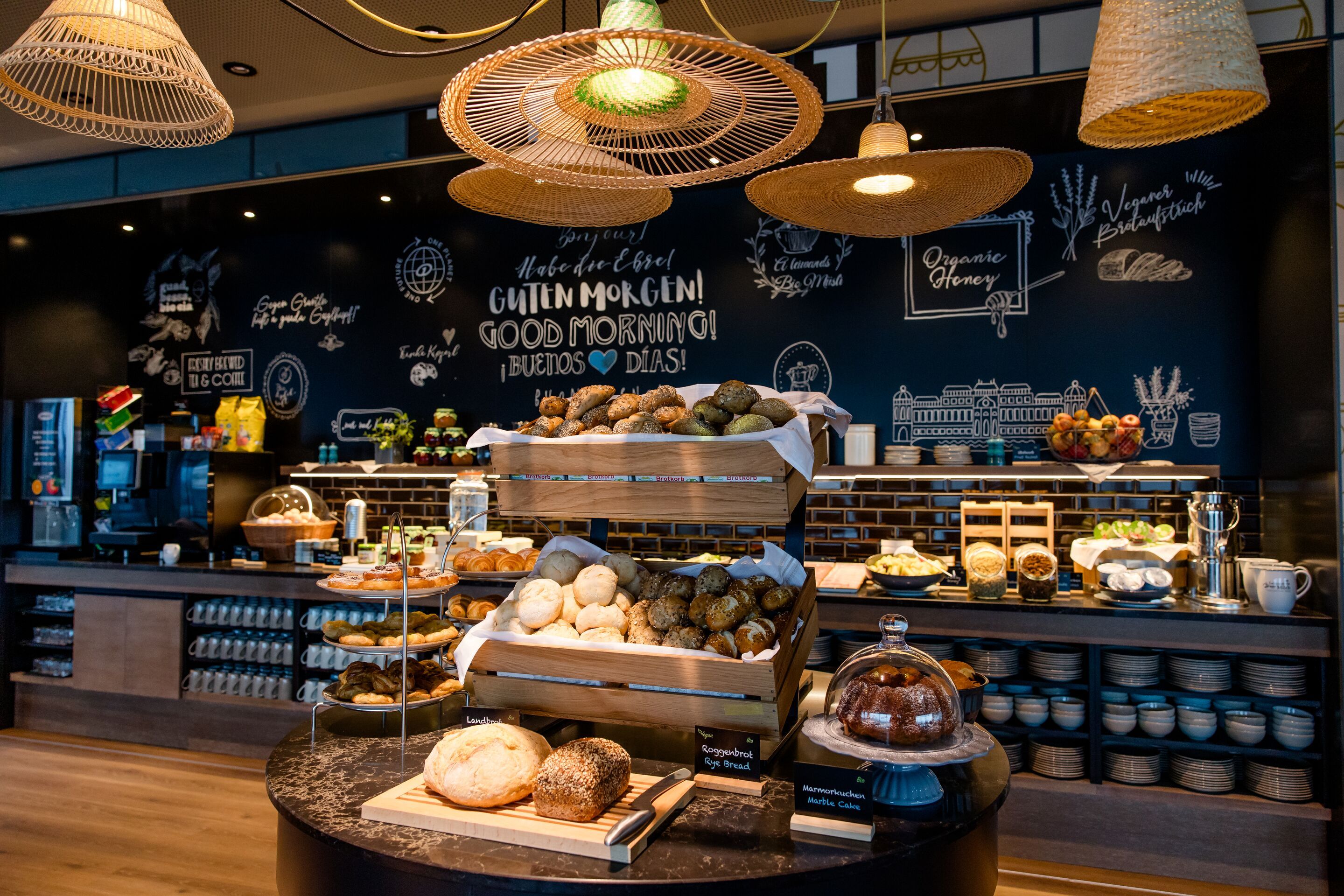 Hotel Vienna Donau City Motel One view of the breakfast buffet with a wide selection of food and drinks
