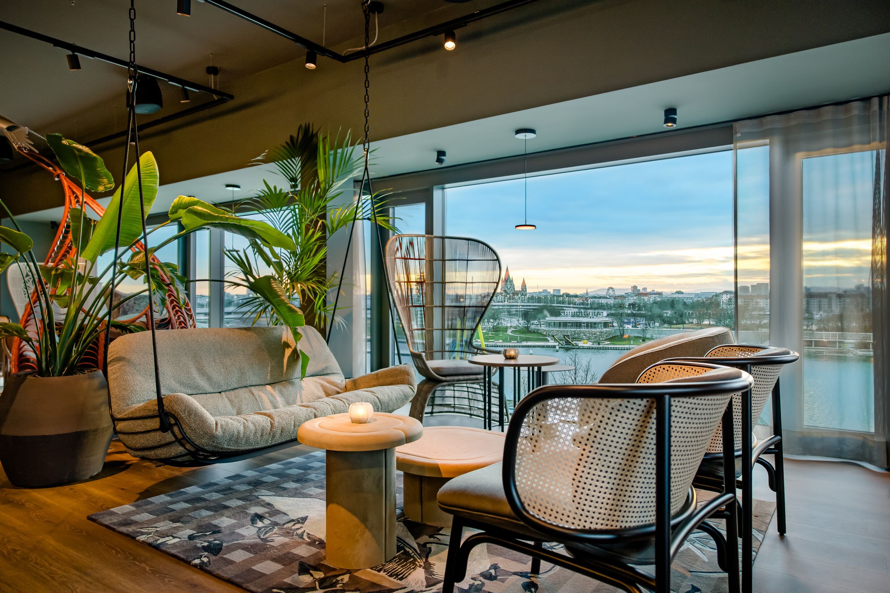 Hotel Vienna Donau City Motel One lounge with floor-to-ceiling windows and a view of the Danube