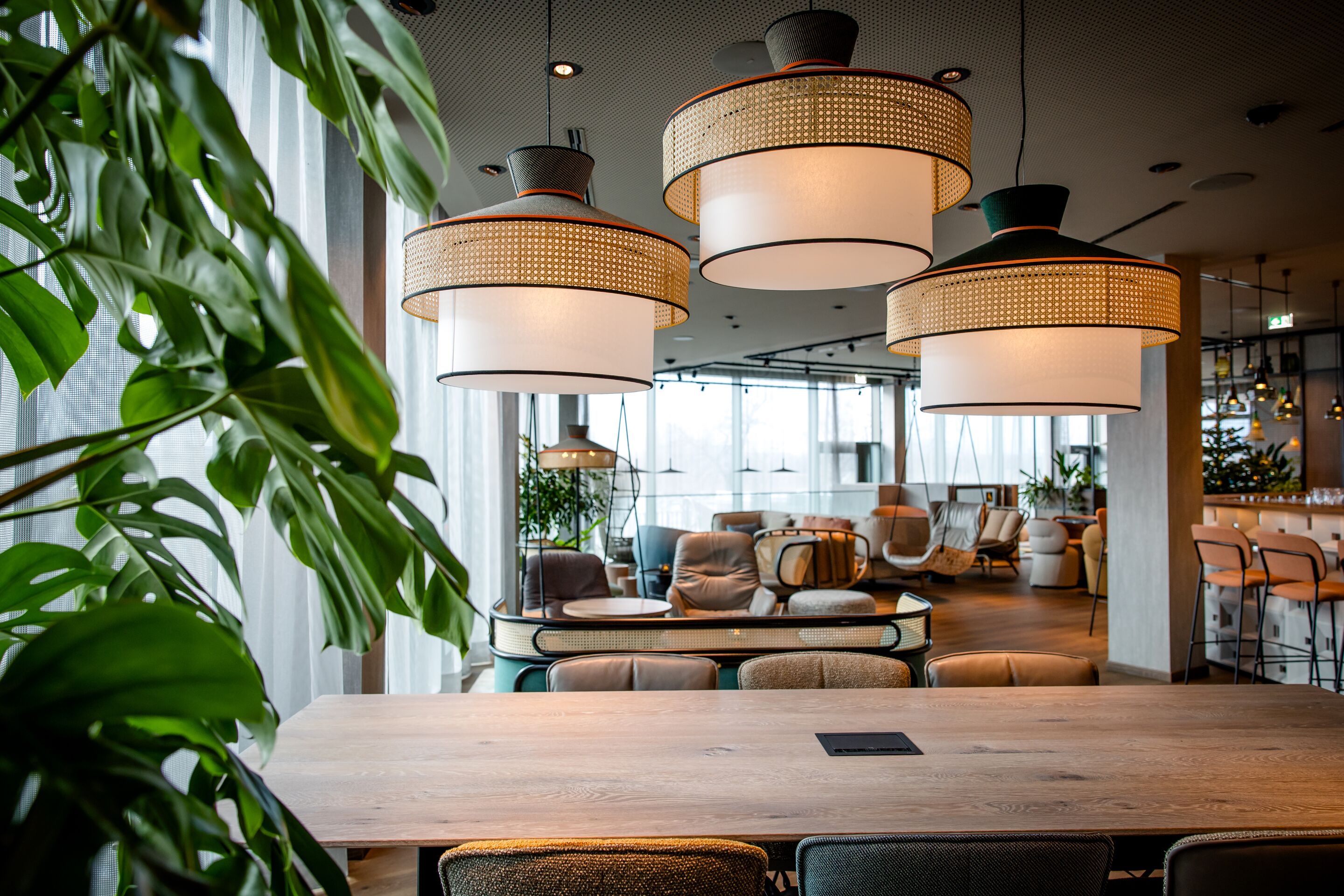 Hotel Vienna Donau City Motel One large and light-filled lounge with several seating areas and floor-to-ceiling windows