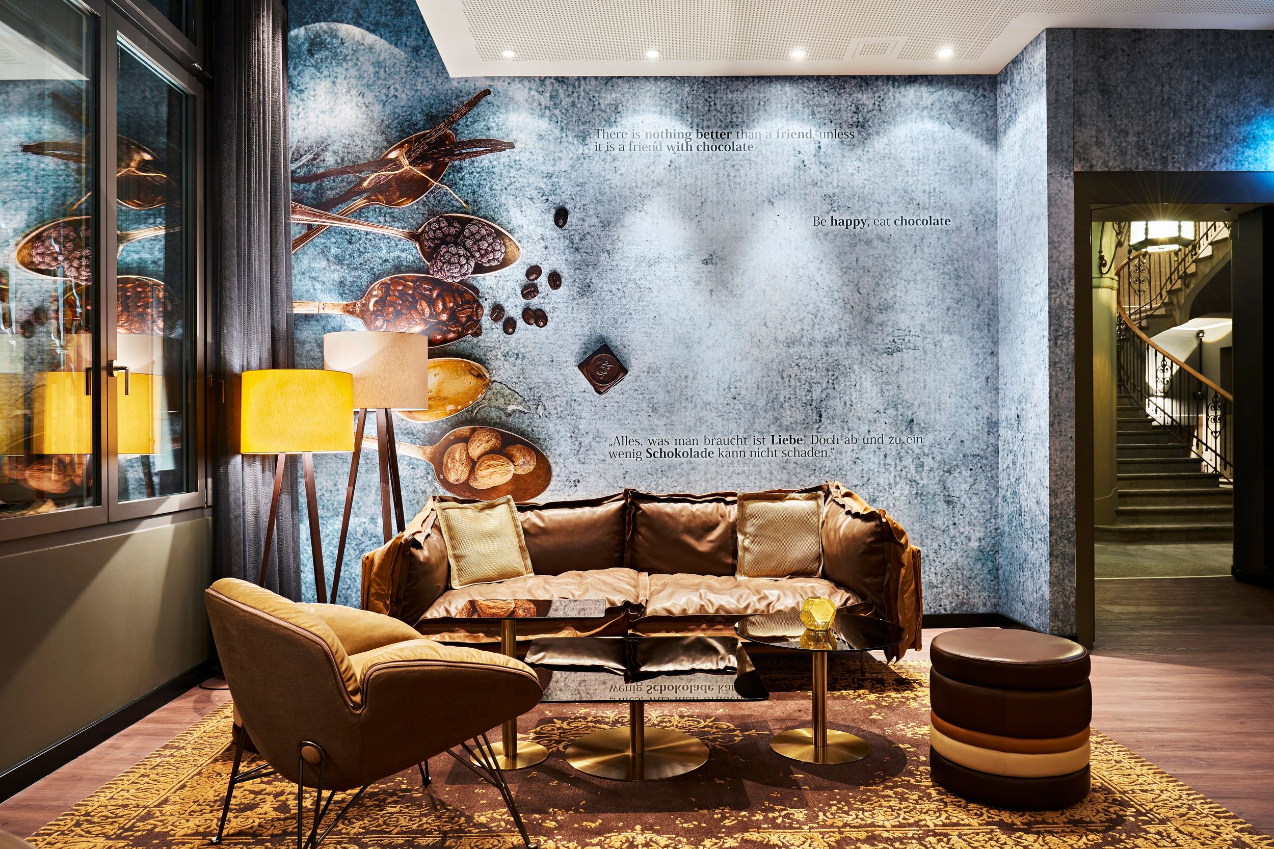 Hotel Zurich Motel One seating area with sofa and armchair