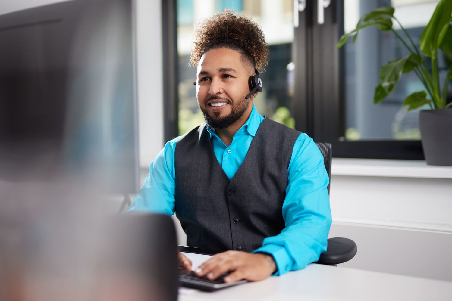 Motel One reservations employee working on his desk Motel One reservations employee working on his desk