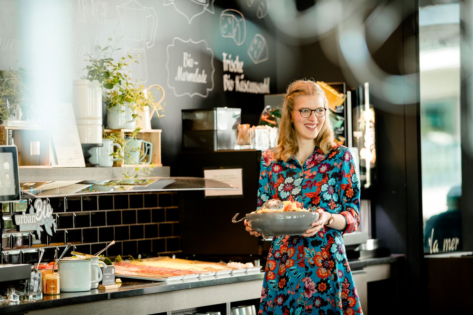 Motel One service employee working in breakfast service Motel One service employee working in breakfast service