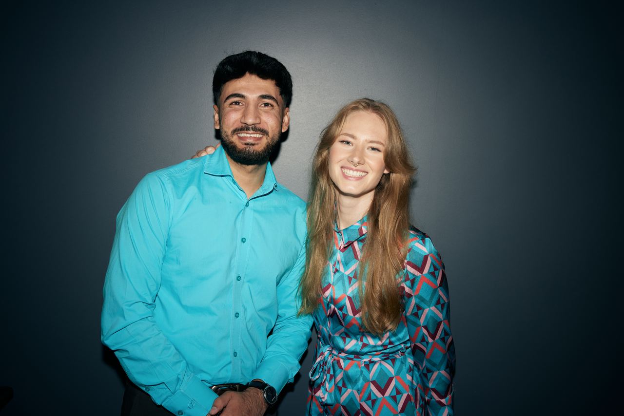 Motel One employees woman and men dressed in turquoise dresscode