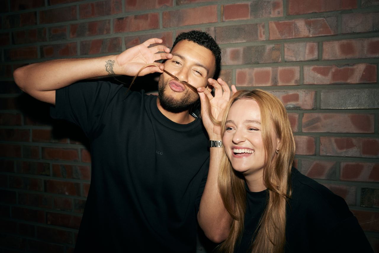 The Cloud One employees woman and man with a fun pose