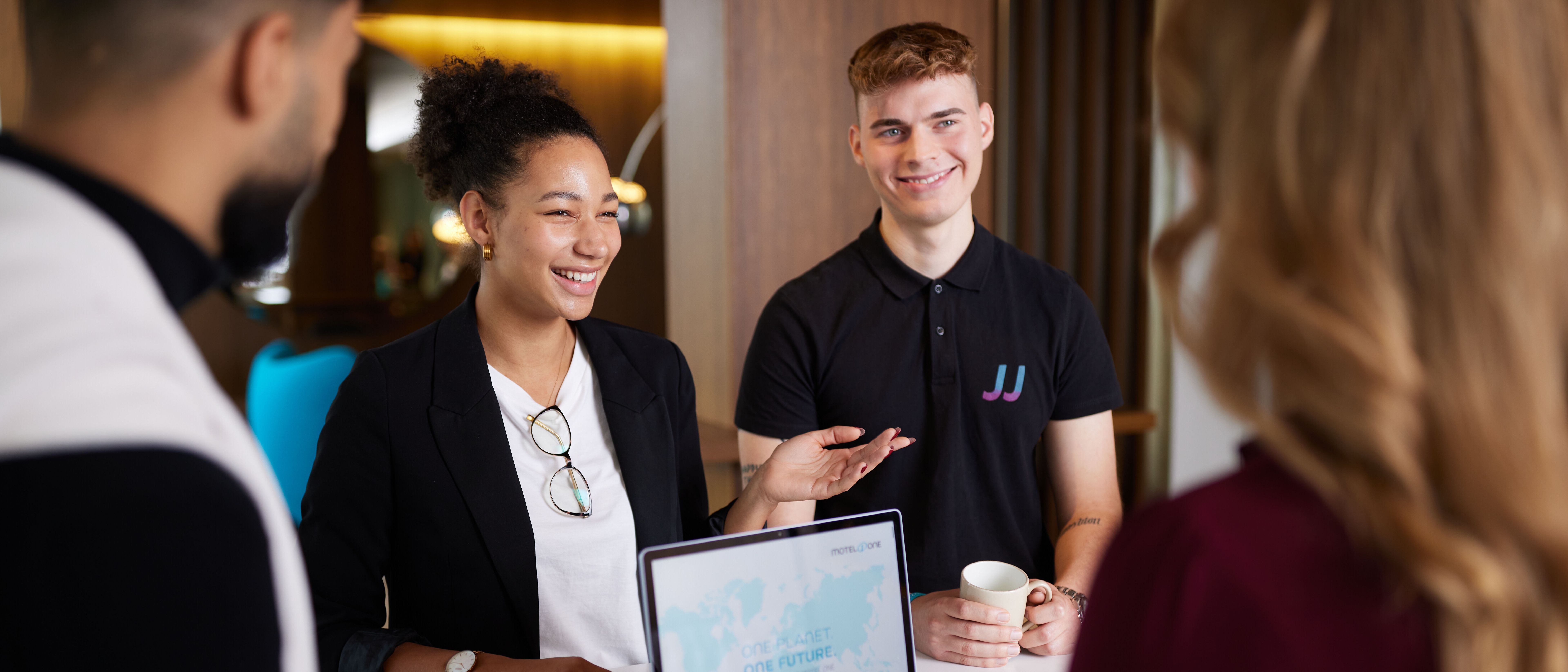 Motel One Group employees in a group discussion