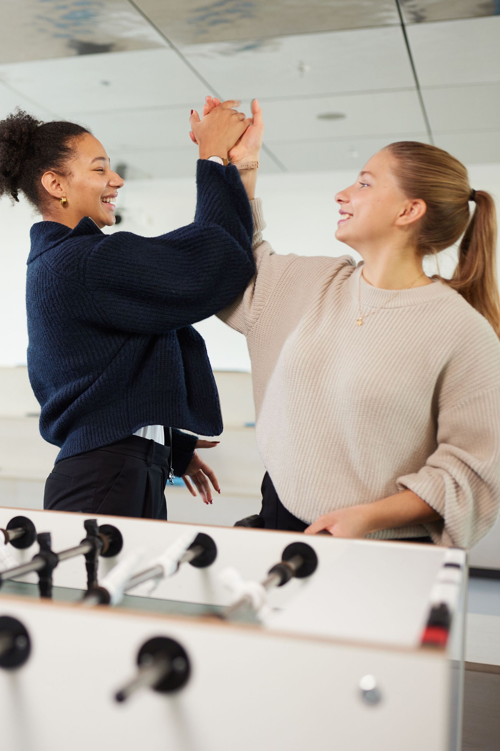 Motel One students playing table soccer