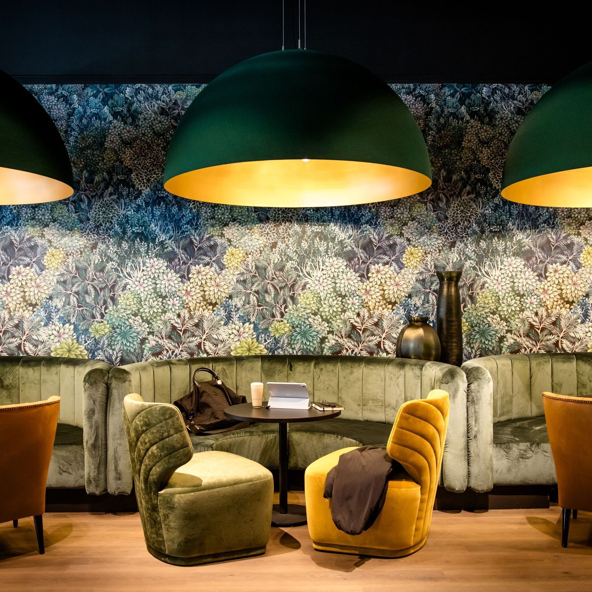 designhotel Munich Central Station Motel One seating areas with large lamps above the tables