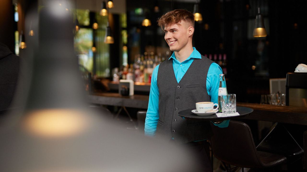 Joel working at the Motel One bar