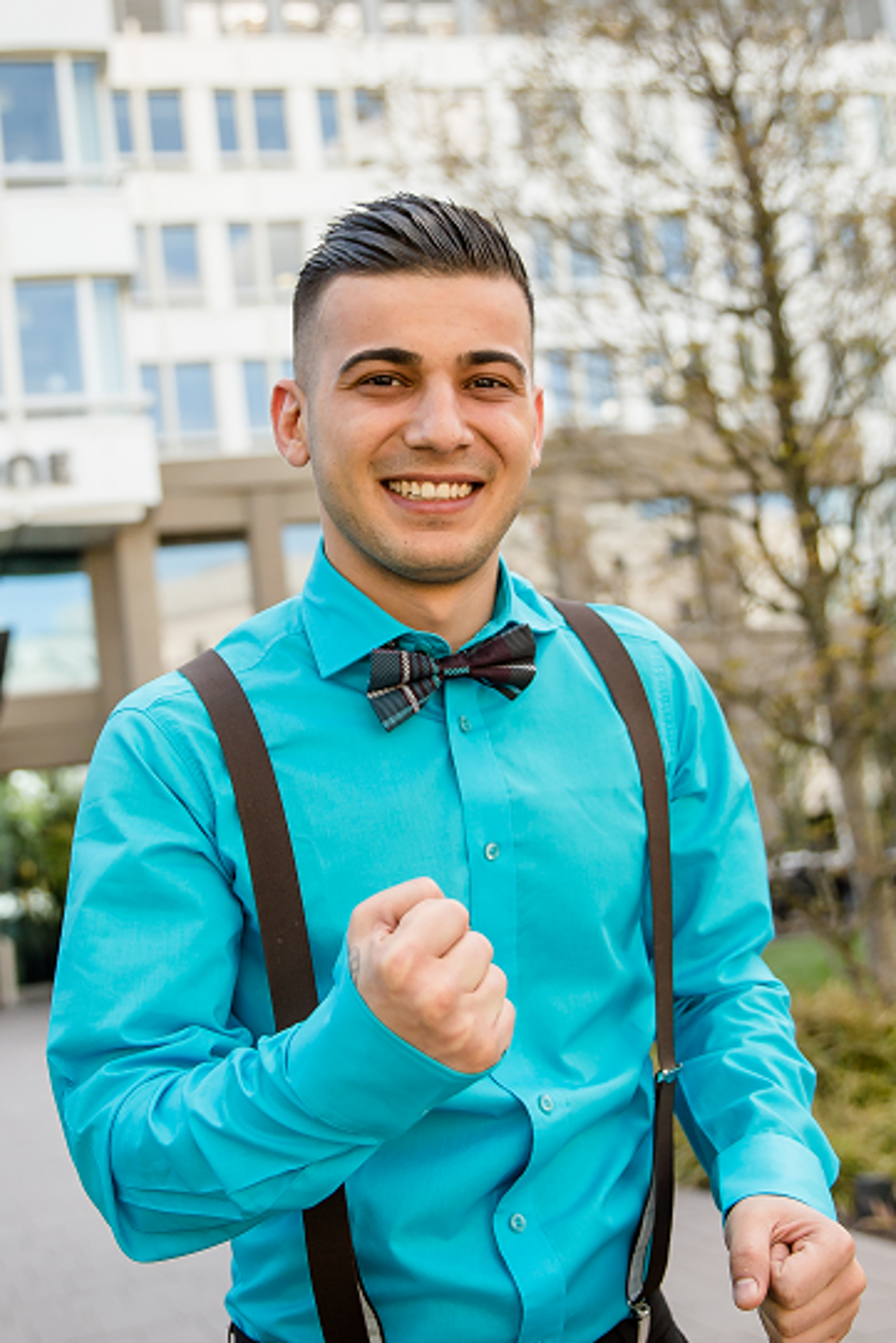 Motel One employee wearing dresscode cheering