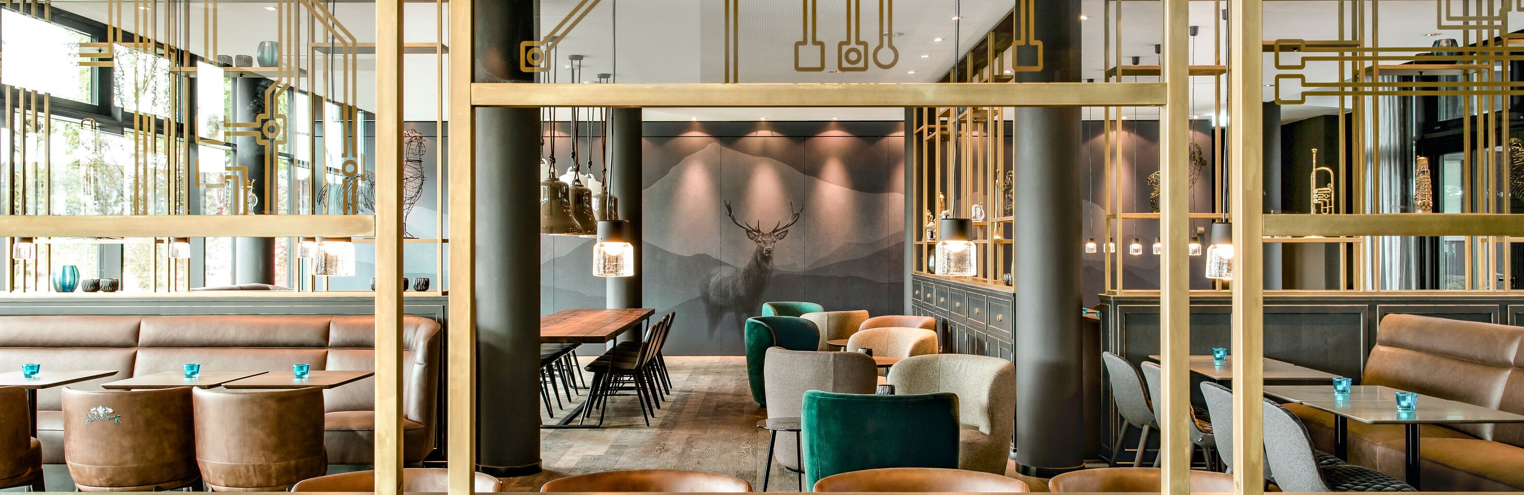 designhotel Munich Parkstadt Schwabing Motel One tables and chairs to linger at