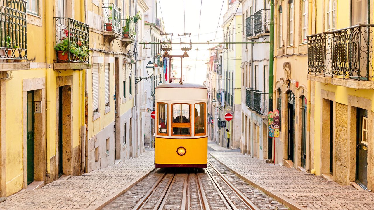Lisbon city with yellow streetcar Lisbon city with yellow streetcar