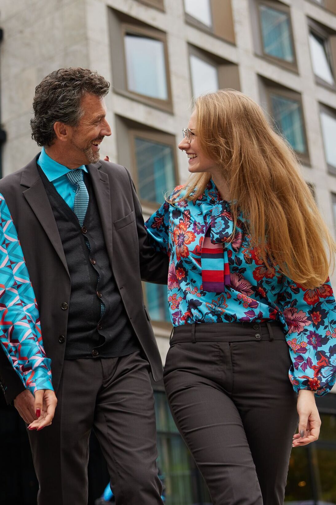 Motel One employees man and woman talking to each other Motel One employees man and woman talking to each other